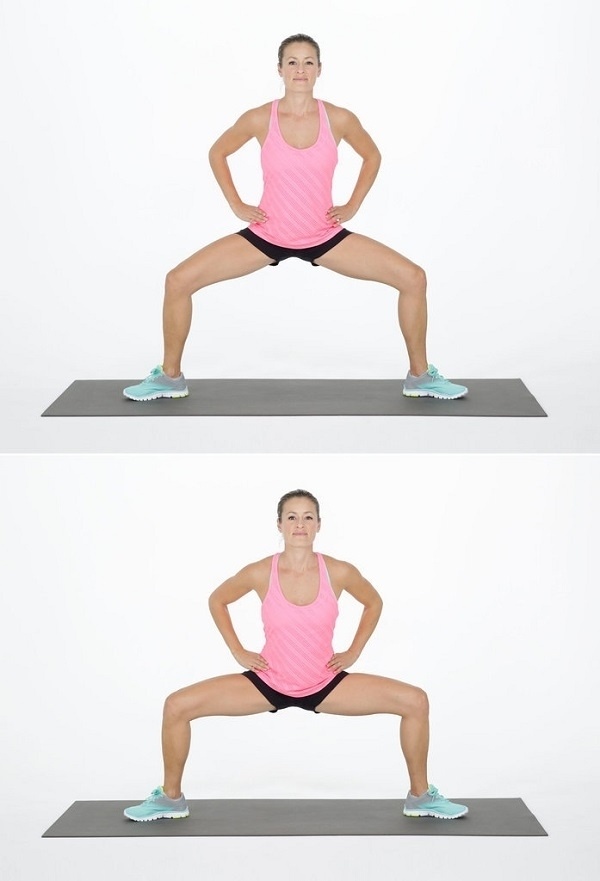 Sumo dřepy - 15 opakování. Dejte pozor, abyste měli rovná záda a paty na podlaze.